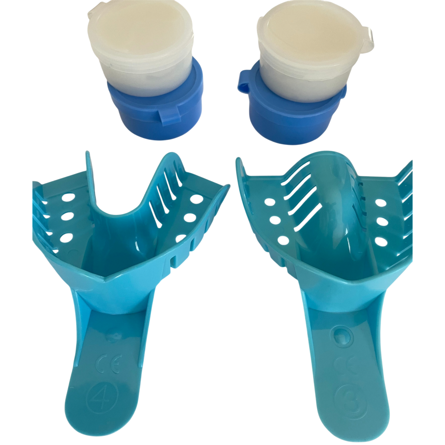 Two blue plastic trays with white dental on a white background