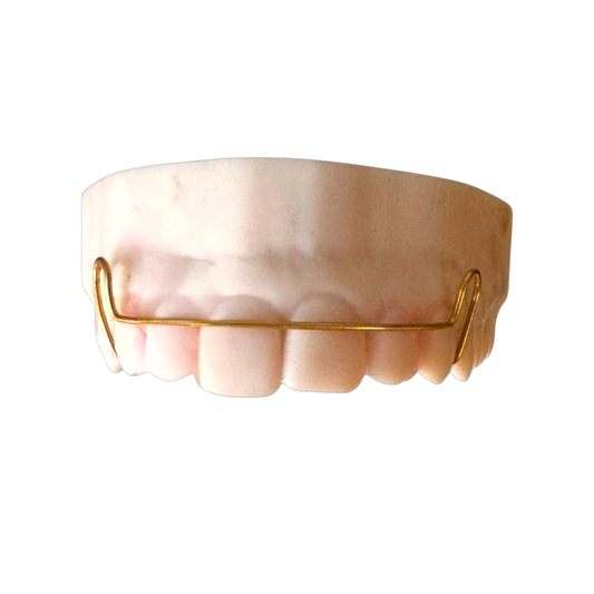 Gold grill on a white background
